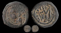 Heraclius (610-641) overstruck on Maurice Tiberius. AE Follis, Constantinople. 10.58g, 30mm.
Overtype: Year 5=614-615, officina B. 
Obv: dd NN hERAC...