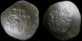 Manuel I (1143-1180) billon Aspron Trachy. Constantinople, 3.15g, 27mm. 
Obv: Christ enthroned facing; star to either side. 
Rev: Manuel standing fa...