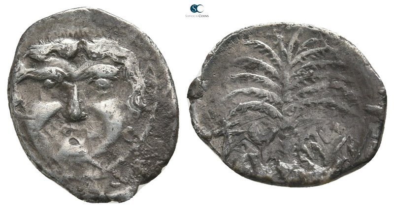 Sicily. Motya 415-397 BC. 
Litra AR

15 mm., 0,70 g.

Gorgoneion / Palm and...