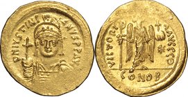 Justinian I (527-565).AV Solidus, Rome mint, 542-552.D/ Bust facing, helmeted, draped, cuirassed, holding globus cruciger.R/ Victory standing facing, ...