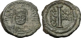 Justinian I (527-565).AE Decanumium. Ravenna mint. Dated RY 36 (562/3 AD).D/ Helmeted and cuirassed facing bust, holding globus cruciger and shield.R/...