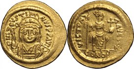 Justin II (565-578).AV Solidus, Ravenna mint, 567-578.D/ Bust facing, helmeted, draped, cuirassed, holding Victory on globe.R/ Constantinopolis enthro...