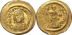 Justin II (565-578).AV Solidus, Ravenna mint, 567-578.D/ Bust facing, helmeted, draped, cuirassed, holding Victory on globe.R/ Constantinopolis enthro...