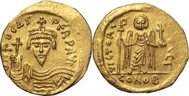 Phocas (602-610).AV Solidus, Constantinople mint, 603-607.D/ Bust facing, crowned, draped, holding globus cruciger.R/ Victory standing facing, holding...