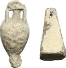 Lot of 2 "groma" weights.
 Roman period, 1st-3rd century AD.
 30 mm, 39 mm high.In the building of a Castra, after having flattened the ground and b...