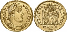 EMPIRE ROMAIN. Magnus Maximus (383-388). Solidus, Trèves. Av. Buste drapé et cuirassé à droite. Rv. Deux empereurs assis de face et tenant ensemble un...