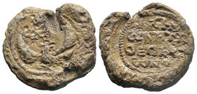 BYZANTINE LEAD SEALS. Theophylaktos, apoeparchon (Circa 7th century). Obv: Eagle standing facing, head right, with wings spread; cruciform monogram ab...