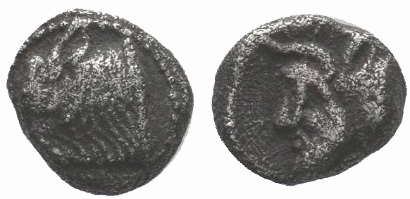 Cilicia, Nagidos AR Obol. c. 420-400. Head of Pan r. / Bearded head of Dionysos ...