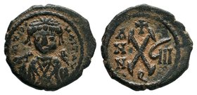 Tiberius II Constantine, AE Decanummium, Antioch mint, 578-582 AD. dN TIO CONTAT PP A, crowned, cuirassed bust facing, holding cross on globe and shie...