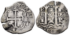 Charles II (1665-1700). 2 reales. 1667. Potosí. E. (Cal-594). Ag. 5,56 g. Triple fecha, la de la leyenda parcial. Visible parte del nombre del rey CAR...
