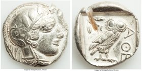 NEAR EAST or EGYPT. Ca. 5th-4th centuries BC. AR tetradrachm (26mm, 17.01 gm, 12h). VF, test cut. Head of Athena right, wearing crested Attic helmet o...