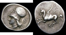 Ancient Greece - Corinth Silver Stater Pegasus Obverse: Helmeted bust of Athena, left, with mailed neck guard, Wheel symbol in right obverse field, Pe...