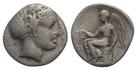 Bruttium, Terina, c. 420-400 BC. AR Triobol (10.5mm, 1.00g, 9h). Head of nymph r., hair in sphendone. R/ Nike seated l. on Ionic capital, holding wrea...