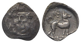 Sicily, Segesta, c. 455/0-445/0 BC. AR Litra (10mm, 0.41g, 12h). Facing head of the nymph Segesta. R/ Hound standing r.; wheel of four spokes above. H...