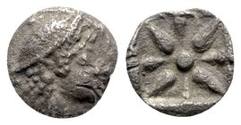 Asia Minor, Uncertain, c. 5th century BC. AR Hemiobol (5.5mm, 0.36g). Helmeted head r. R/ Eight-rayed star. Unpublished in the standard references. VF