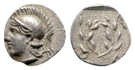 Aeolis, Elaia, c. 450-400 BC. AR Hemiobol (7mm, 0.42g, 6h). Helmeted head of Athena l. R/ Wreath. SNG Copenhagen 164. Good VF