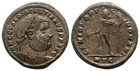 Diocletian (284-305). Æ Follis (29mm, 10.76g, 6h). Heraclea, c. 296-7. Laureate head r. R/ Genius standing l., holding patera and cornucopiae; HTЄ. RI...