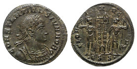 Constantine II (Caesar, 316-337). Æ Follis (18mm, 2.16g, 12h). Siscia, 330-3. Laureate and cuirassed bust r. R/ Two signa between two soldiers, each h...