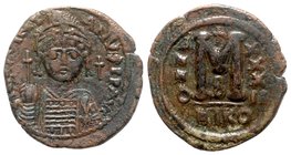 Justinian I (527-565). Æ 40 Nummi (34mm, 17.35g, 6h). Nicomedia, year 32 (558/9). Helmeted and cuirassed facing bust, holding globus cruciger and shie...