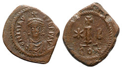 Maurice Tiberius (582-602). Æ 10 Nummi (21mm, 3.30g, 6h). Constantinople. Helmeted, draped and cuirassed facing bust. R/ Large I; cross above, star to...