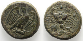 Sicily, Akragas, c. 420-406 BC. Æ Hemilitron (28mm, 20.15g, 3h). Eagle standing r., head raised, on dead hare. R/ Crab; below, Triton r., blowing into...