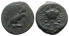 Sicily, Akragas, c. 420-406 BC. Æ Tetras – Trionkion (23mm, 10.34g, 6h). Eagle, wings raised, standing r. on, and tearing at, dead hare. R/ Crab; belo...