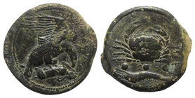 Sicily, Akragas, c. 420-406 BC. Æ Tetras – Trionkion (22mm, 10.04g, 6h). Eagle, wings raised, standing r. on, and tearing at, dead hare. R/ Crab; belo...