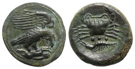 Sicily, Akragas, c. 420-406 BC. Æ Tetras – Trionkion (22mm, 5.61g, 3h). Eagle, wings raised, standing r. on, and tearing at, dead hare. R/ Crab; below...