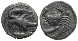 Sicily, Akragas, c. 420-406 BC. Æ Hexas (18mm, 7.88g, 1h). Eagle with spread wings, standing l., tearing at hare in talons. R/ Crab; two fish below. W...