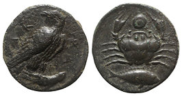 Sicily, Akragas, c. 415-406 BC. Æ Onkia (15mm, 3.40g, 2h). Eagle standing r. with head reverted, on a fish. R/ Crab; grouper below; pellet between cra...
