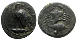 Sicily, Akragas, c. 415-406 BC. Æ Onkia (16mm, 3.85g, 3h). Eagle standing l. with head reverted, on a fish. R/ Crab; grouper and pellet below. Westerm...
