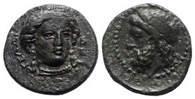 Sicily, Gela, c. 315-310 BC. Æ (13.5mm, 2.76g, 11h). Head of Demeter facing slightly r., wearing wreath of grain ears. R/ Horned and bearded head of G...