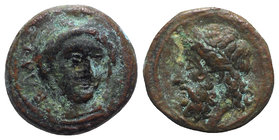 Sicily, Gela, c. 315-310 BC. Æ (13mm, 2.70g, 12h). Head of Demeter facing slightly r., wearing wreath of grain ears. R/ Horned and bearded head of Gel...