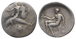 Southern Apulia, Tarentum, c. 425-415 BC. AR Nomos (22mm, 7.42g, 12h). Phalanthos, r. arm outstretched and holding shield on l. arm, riding dolphin l....