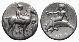 Southern Apulia, Tarentum, c. 365-355 BC. AR Nomos (20mm, 7.67g, 6h). Nude youth on horse standing r.; to r., herm l.; HE below. R/ Phalanthos, holdin...