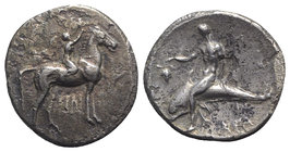 Southern Apulia, Tarentum, c. 302-280 BC. AR Nomos (24mm, 6.51g, 9h). Youth on horseback r., crowning horse with wreath; [ΣA to l.], [ΦIΛI/APXOΣ in tw...