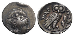 Southern Apulia, Tarentum, c. 302-280 BC. AR Drachm (16.5mm, 3.16g, 11h). Helmeted head of Athena r., helmet decorated with Skylla throwing stone. R/ ...