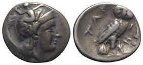 Southern Apulia, Tarentum, c. 302-280 BC. AR Drachm (15mm, 3.25g, 6h). Helmeted head of Athena r., helmet decorated with Skylla throwing stone. R/ Owl...