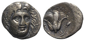 Islands of Caria, Rhodes, c. 229-205 BC. AR Drachm (13mm, 3.26g, 12h). Uncertain magistrate. Head of Helios facing slightly r. R/ Rose with bud to r. ...