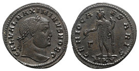 Maximinus II (Caesar, 305-309). Æ Follis (26mm, 5.99g, 12h). Cyzicus, 308-9. Laureate head r. R/ Genius standing l., holding patera and cornucopia; Γ/...