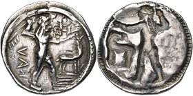 BRUTTIUM, CAULONIA, AR statère, 500-480 av. J.-C. D/ Apollon deb. à d., brandissant un rameau et ten. un petit daimon courant sur son bras g. tendu. A...