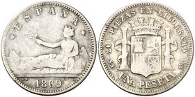 1869*(18)69. Gobierno Provisional. SNM. 1 peseta. (Cal. 15). 4,65 g. Leyenda: ESPAÑA. Muy escasa. BC.