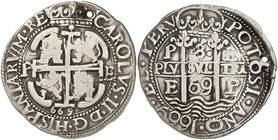 1669. Carlos II. Potosí. E. 8 reales. (Cal. 305) (Lázaro 181). 26,42 g. Redonda. Tipo "real". Triple fecha. Perforación. Muy rara. MBC+.