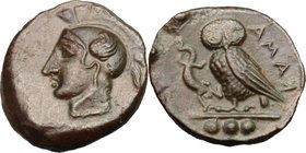 Sicily. Kamarina. AE Tetras, c. 420-410 BC. D/ Head of Athena left, wearing Corinthian helmet decorated with a wing. R/ KAMA. Owl standing left, head ...