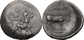 Sicily. Selinos. AR Litra, c. 466-415 BC. D/ Nymph seated left, holding snake with right hand at arm's lenght, leaning on rock to right, celery leaf a...