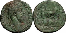 Commodus (177-192). AE Sestertius, 186 AD. D/ M COMMODVS ANT P FELIX AVG BRIT. Laureate head right. R/ Commodus seated left on platform, attended by o...