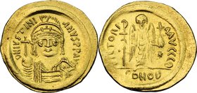 Justinian I (527-565). AV Solidus, Constantinople mint, c. 545-565 AD. D/ DN IVSTINI-ANVS PP AVI. Helmeted and cuirassed bust facing, holding globus c...