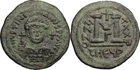 Justinian I (527-565). AE Follis, Antioch/Theoupolis mint. D/ DN IVSTINIANVS PP AVG. Helmeted and cuirassed bust facing, holding globus cruciger and s...