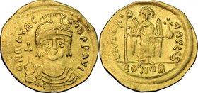 Maurice Tiberius (582-602). AV Solidus, Constantinople mint. D/ dN mAVRC TIb PP AVI. Draped and cuirassed bust facing, wearing plumed helmet and holdi...