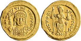 Justin II, 565-578. Solidus (Gold, 20 mm, 4.36 g, 6 h), Constantinopolis. D N IVSTINVS P P AVI Helmeted and cuirassed bust of Justin II facing, holdin...